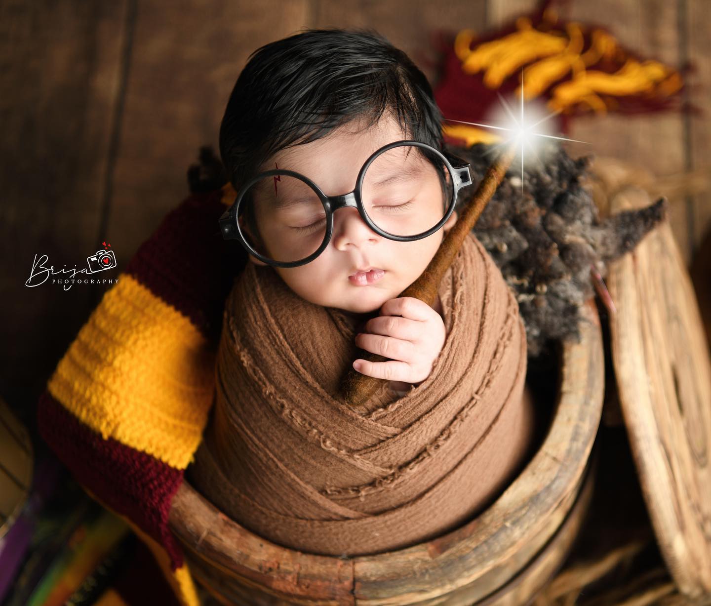 Newborn baby photographed in soft neutral tones