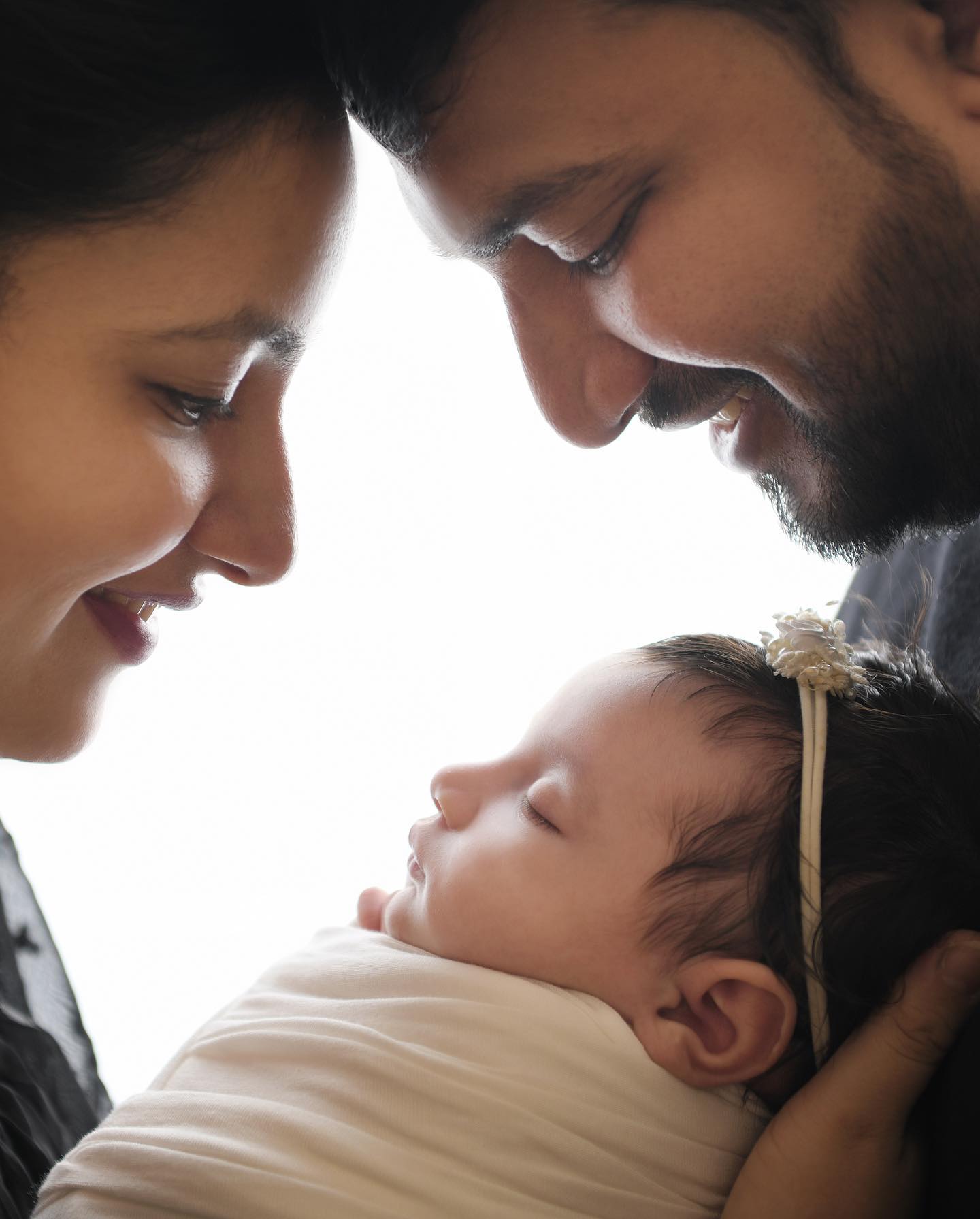 Soft maternity bump portrait in warm light