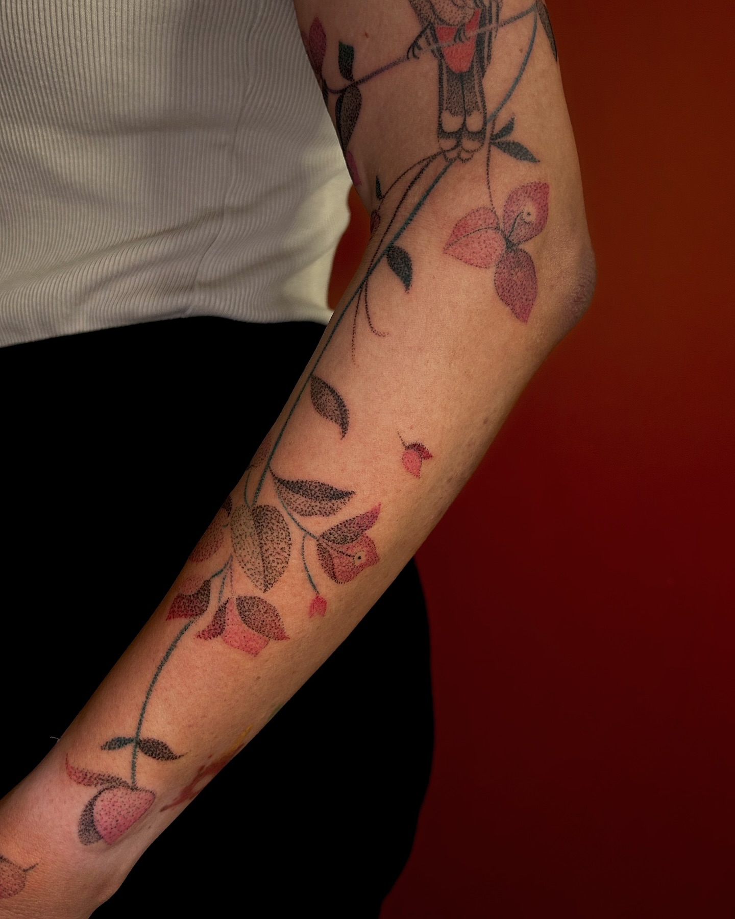 Minimal botanical handpoke tattoo by Shivani (@stickitytats)